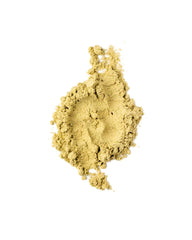 Jar of Bella All Natural Extreme Detox Powder on a kitchen table.