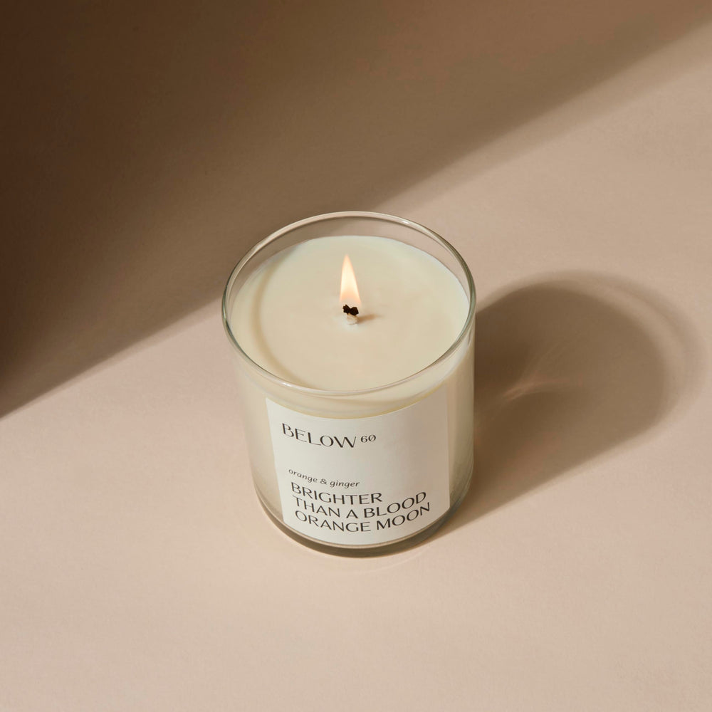Below 60 blood orange ginger candle side view for daytime glow