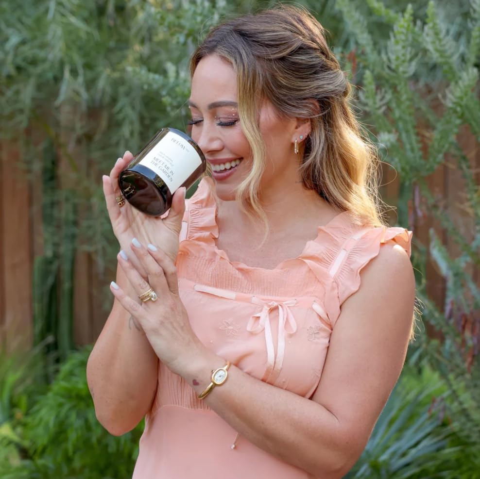 Below 60 Hilary Duff Meet Me in the Garden fragrance-notes display highlights Black Currant, Rose, Violet Leaf.