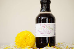 Berryqueen elderberry syrup bottle, perfect for mixing with yogurt or tea for daily wellness.