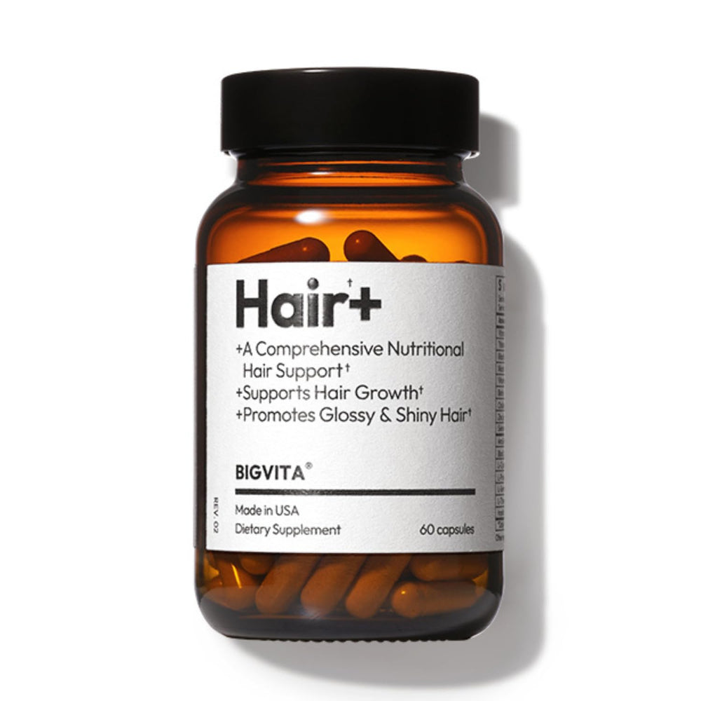 BIGVITA Hair Growth Supplement bottle on a clean desk for daily use and fuller hair goals