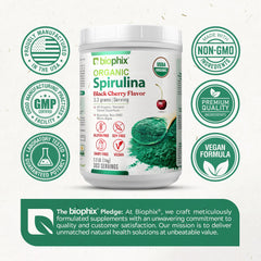 Biophix Organic Spirulina Cherry jar on kitchen counter beside fresh fruit.