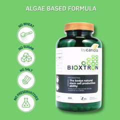 Bottle against soft green background emphasizes natural ingredients.