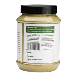 Bixa Botanical Vasaka powder scoop pouring for easy measurement.