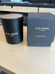 Blue Lagoon Skin Science candle lit glow creates serene home spa ambiance.