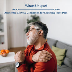 Hands massaging Blue Nectar oil into the shoulder and neck area