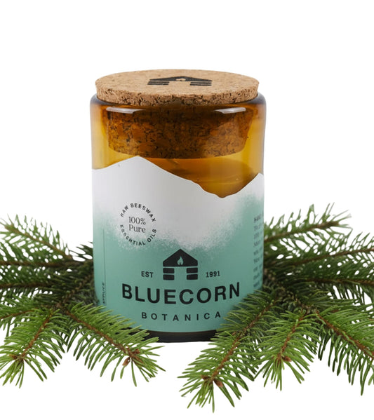 Bluecorn Beeswax Candle in amber glass holder glows with warm, clean light