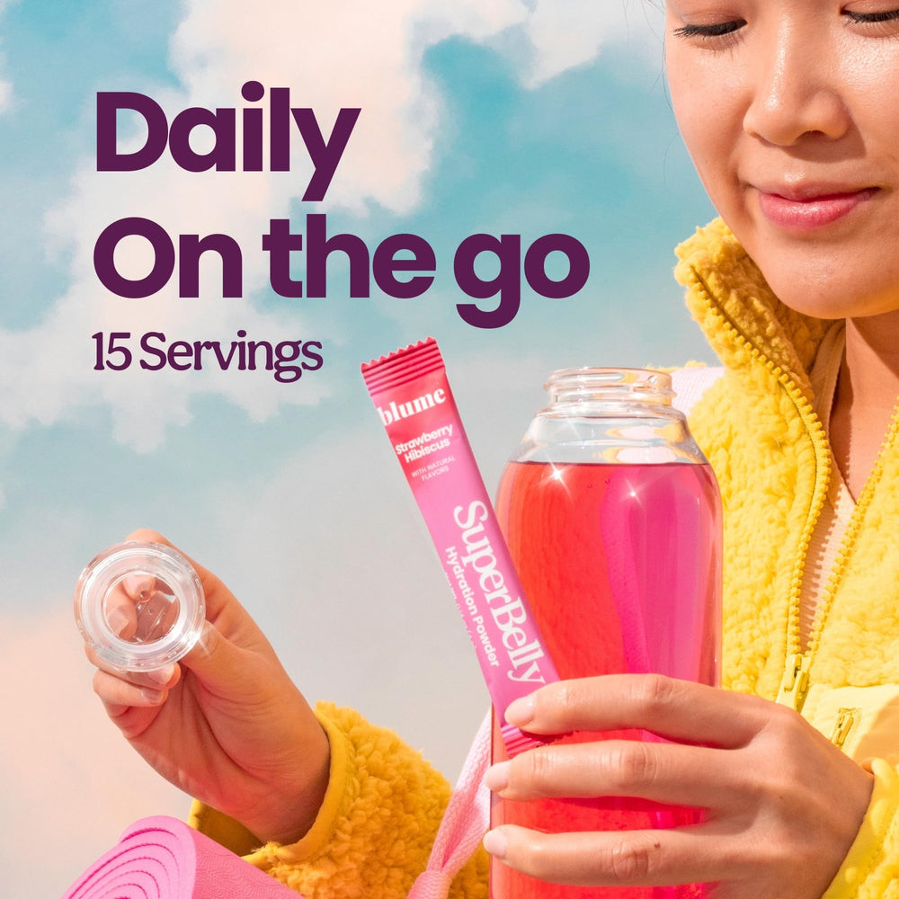 Blume SuperBelly probiotic powder dissolves in water to support daily digestion.