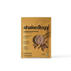 Creamy BODi Shakeology Cafe Latte shake poured into a glass.