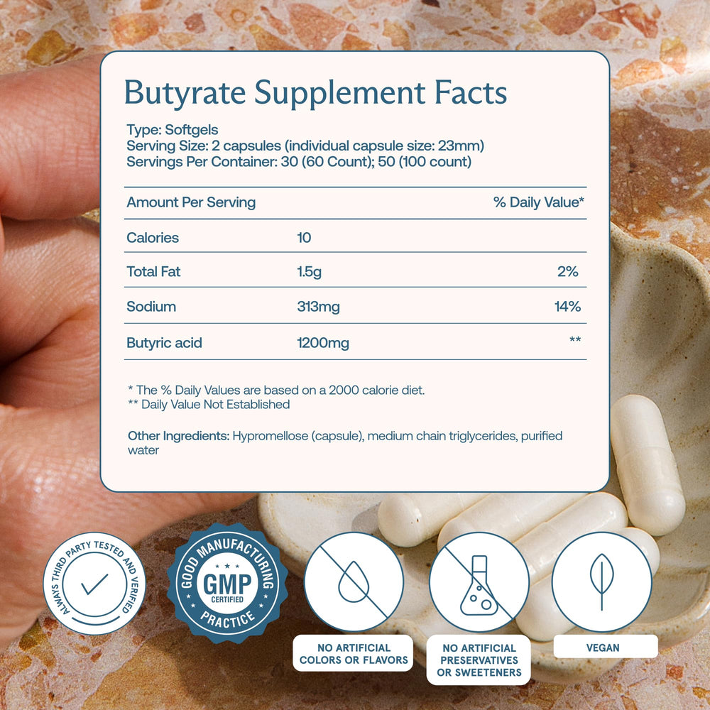 BodyBio Butyrate capsules in hand suggest daily gut support.