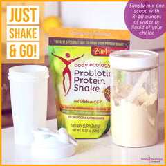 Bodycology probiotic protein shake scoop in glass shows quick mixing for on‑the‑go meals