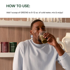 BodyHealth Greens smoothie in glass highlighting green apple flavor.