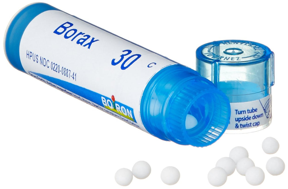 Boiron Borax 30C pellets close-up, tiny beads for gentle dosing.