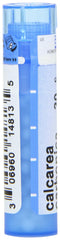Boiron Calcarea Carbonica 30C pellets on tongue illustrate quick dissolution.