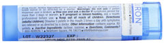 Boiron Kali Phosphoricum packaging on a medicine cabinet shelf.