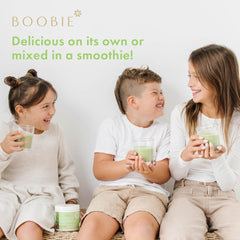 Boobie Brands family sharing a greens drink at home, kids included.