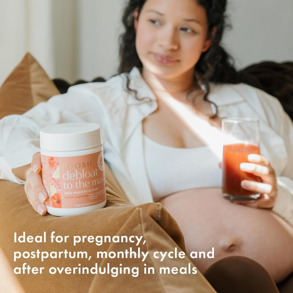 Boobie Debloat to the Max bottle on kitchen counter beside a measuring spoon for easy daily use