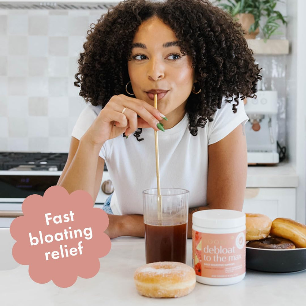 Boobie Debloat to the Max powder in a glass with lemon hibiscus aroma and refreshing flavor