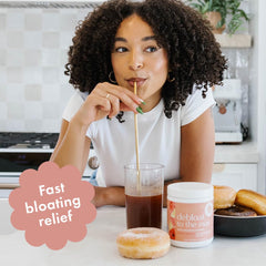 Boobie Debloat to the Max powder in a glass with lemon hibiscus aroma and refreshing flavor
