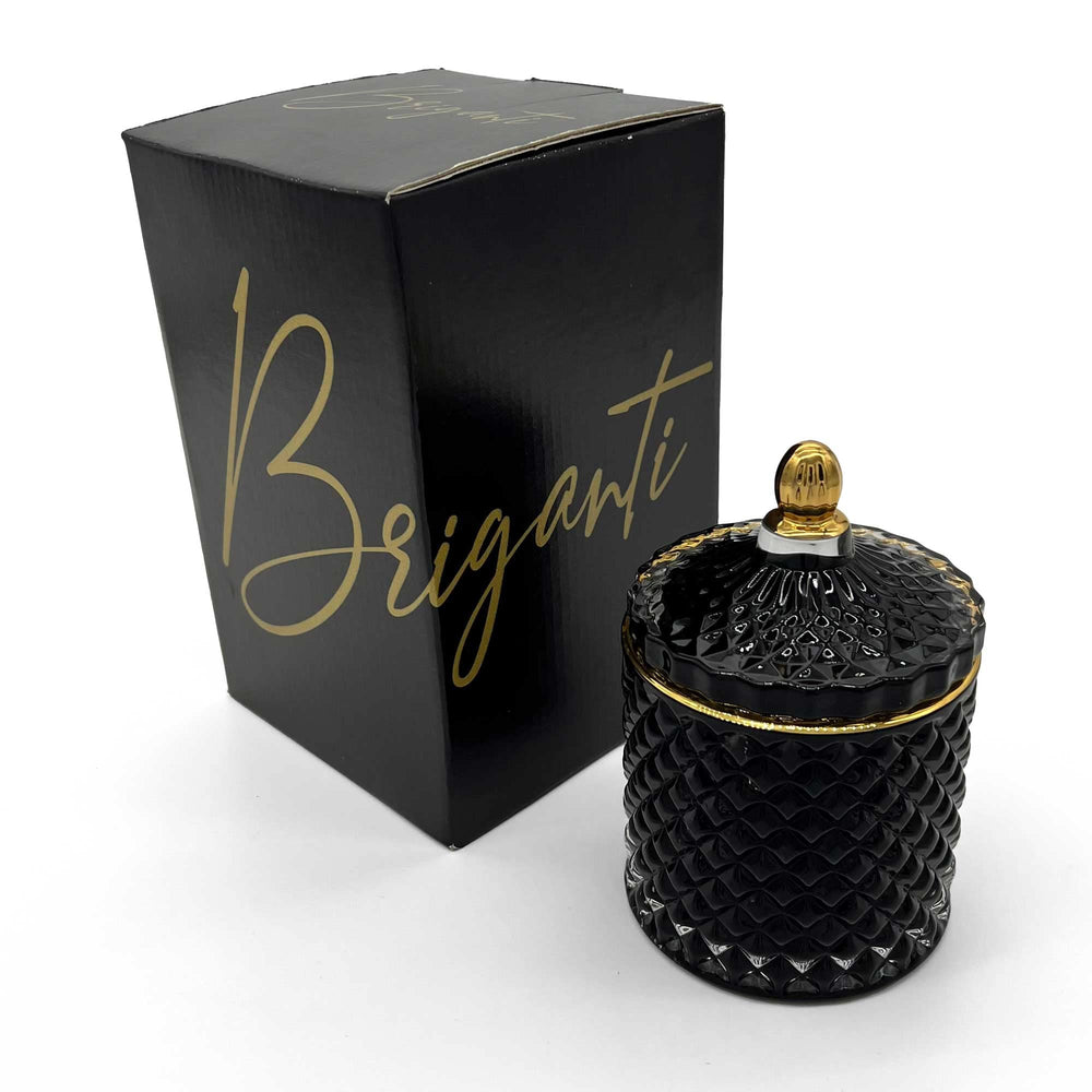 BRIGANTI Coconut Island candle in a black glass jar adds elegant ambiance to any room.