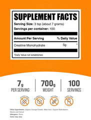 BulkSupplements Creatine Monohydrate Orange Smash with measuring scoop for easy dosing