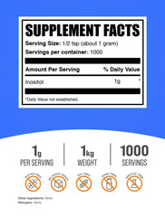 Pouring BulkSupplements Inositol powder into a scoop for convenient supplementation