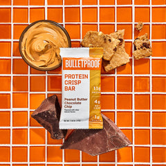 Bulletproof Protein Crisp Bar cross-section highlights crisp texture and peanut crunch.