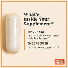 Capsules pouring from Bulletproof Zinc with Copper into a glass for easy daily intake