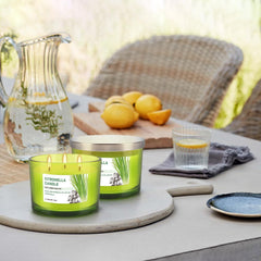 CAKETYCG outdoor dining ambiance candle near table settings.