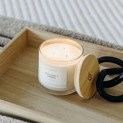 Calyan Vetiver & Tonka candle on table, perfect for gifting.