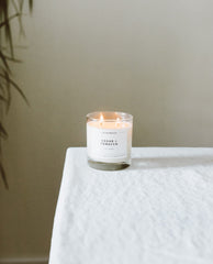 Calyan Wax Co Cedar & Tobacco candle in a modern living room setting