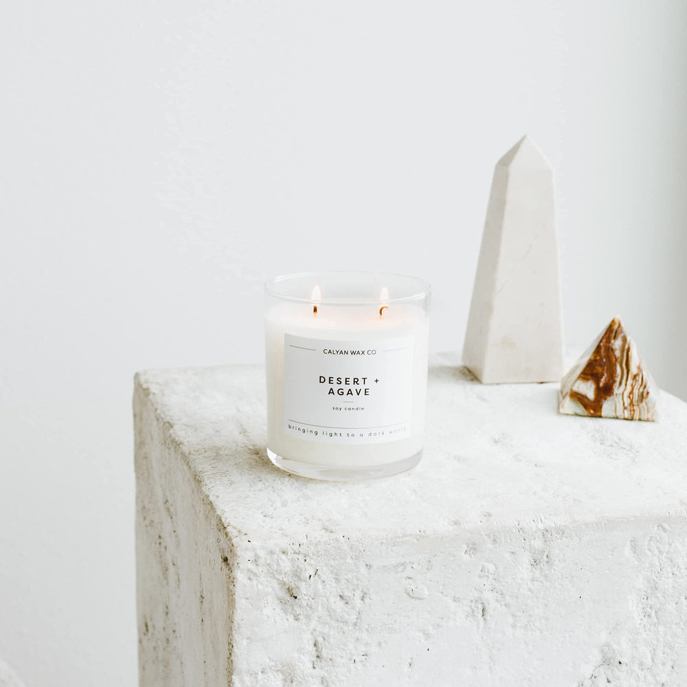 Calyan Wax Co. Desert & Agave candle lit creates warm ambiance.