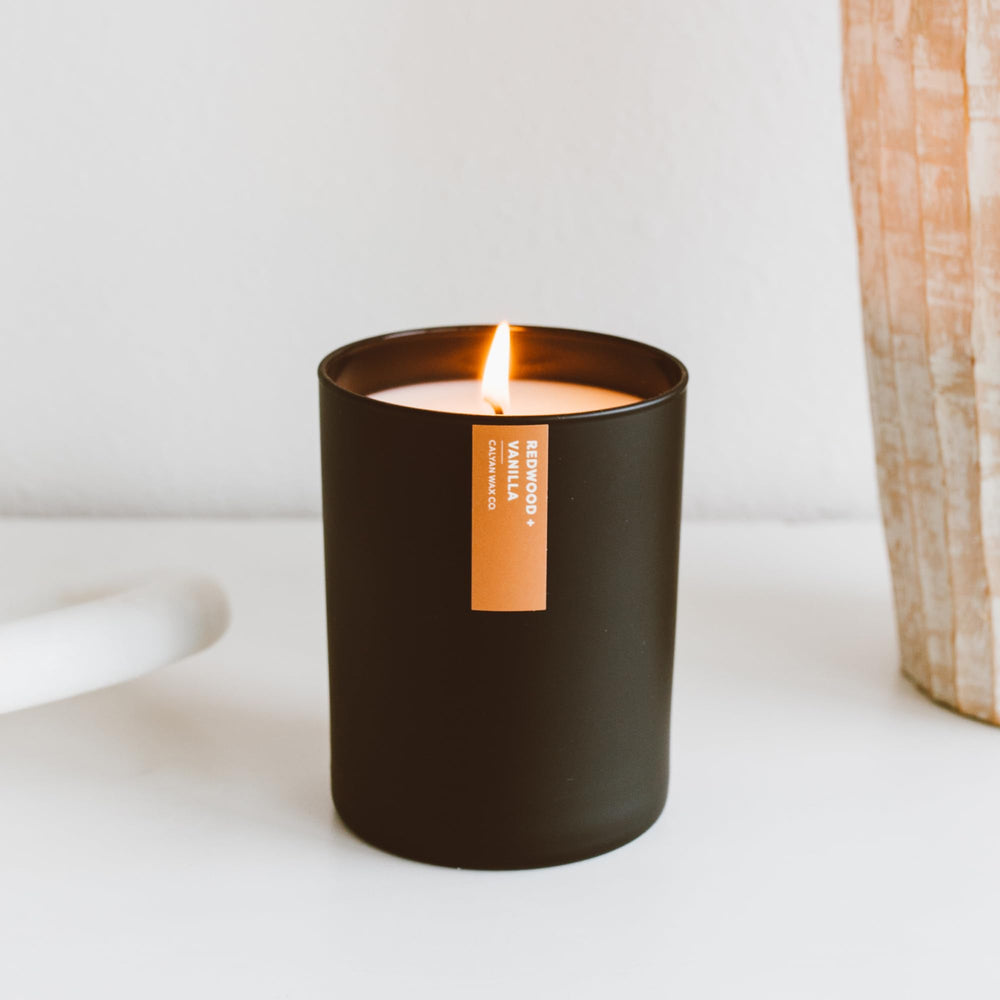 Calyan Wax Co. candle in a living room scene, luxurious ambiance