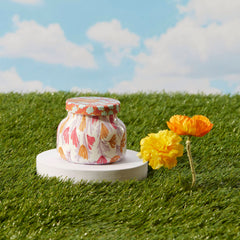 Capri Blue Pineapple Flower candle releasing tropical notes to brighten rooms.