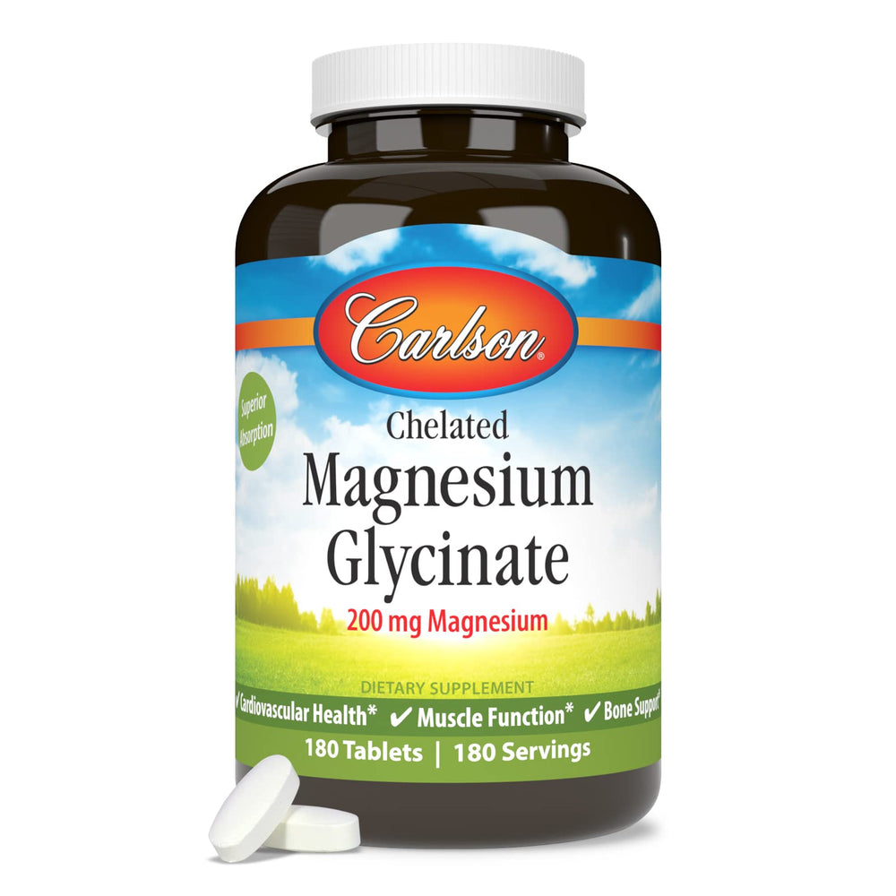 Carlson Chelated Magnesium 200 mg bottle beside a glass of water for easy daily supplementation.