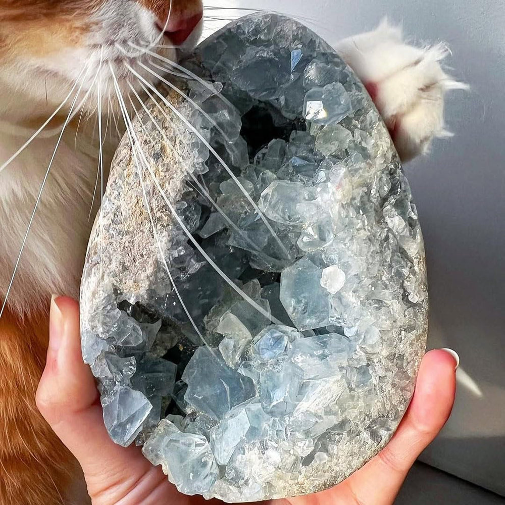 Natural Celestine Cluster with blue quartz geode on desk for calming focus
