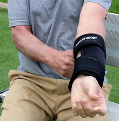 Cold One orthopedic elbow support with adjustable straps for secure fitting.