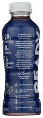 Glass of Come Ready Protein Water Blueberry ready-to-drink after a workout for recovery.