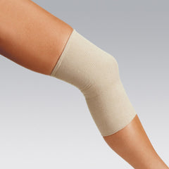 Coverflex Grip tubular bandage on the foot supports swelling and secure dressing during activity.