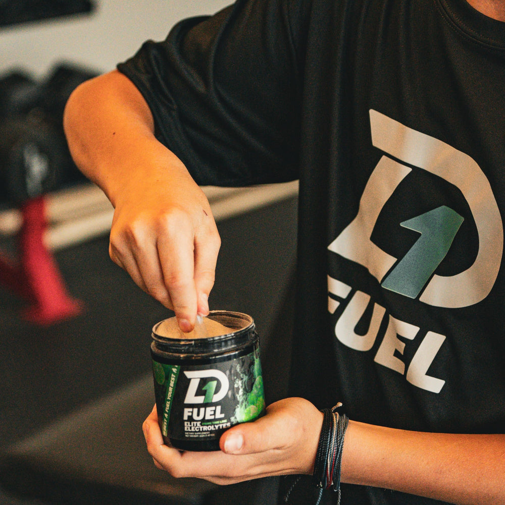 Scoop of D1 Fuel Elite Prime Time Lime powder ready to mix for hydration
