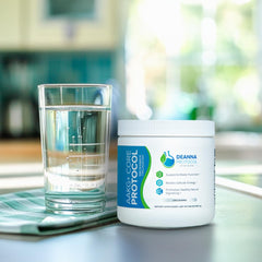 Deanna Protocol AAKG+ Core Powder being poured into a glass shows smooth texture and mixability.