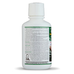 Deca Aloe Arborescens US bottle on a shelf in bright kitchen.