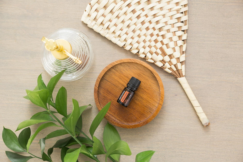 doTERRA Arborvitae hiking setup shows wrist and ankle application outdoors