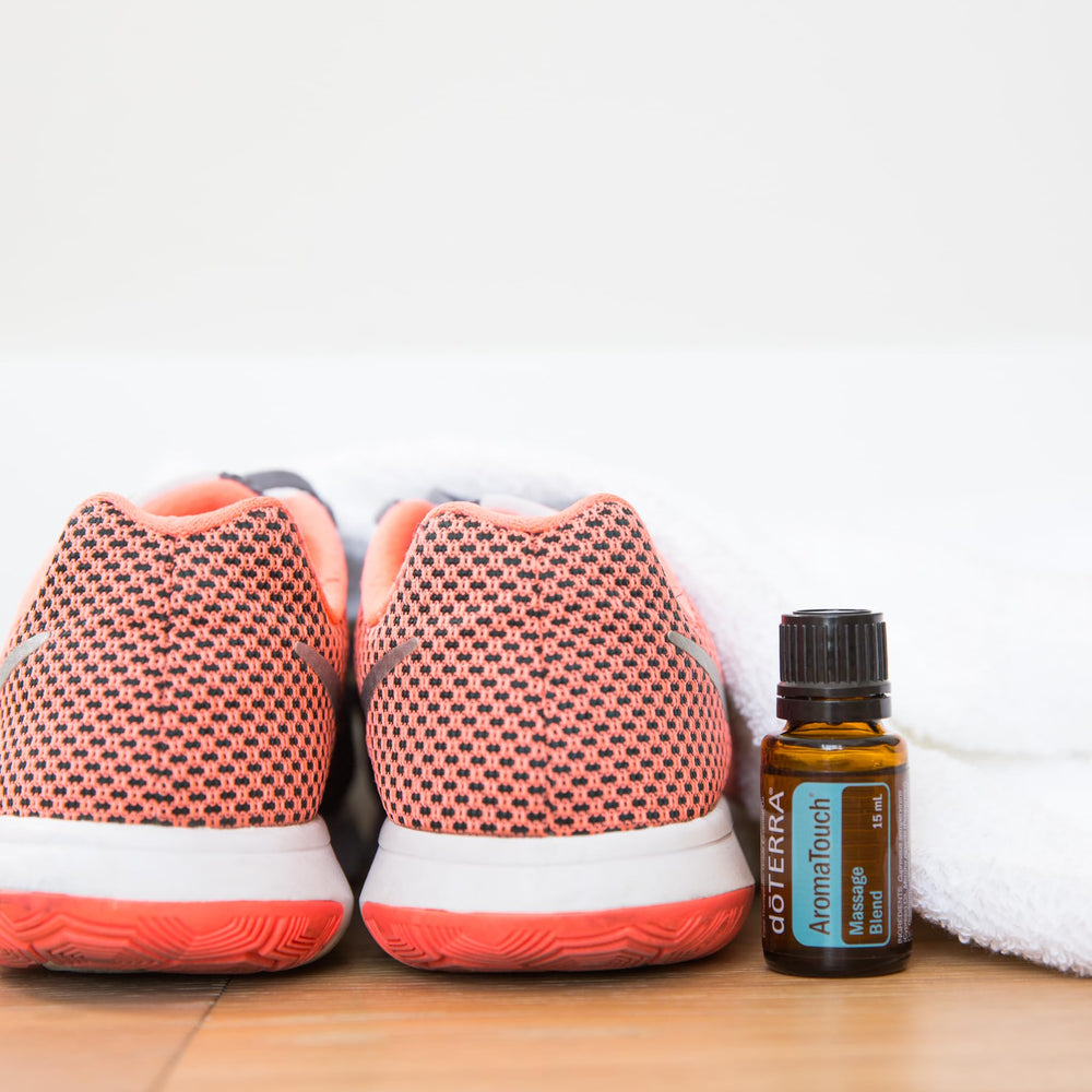 doTERRA AromaTouch droplets and bottle during a spa-at-home routine.