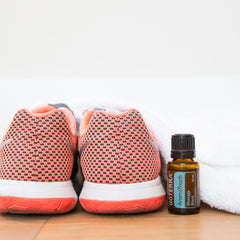 doTERRA AromaTouch droplets and bottle during a spa-at-home routine.