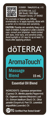 doTERRA AromaTouch lifestyle shot showing home massage setup.