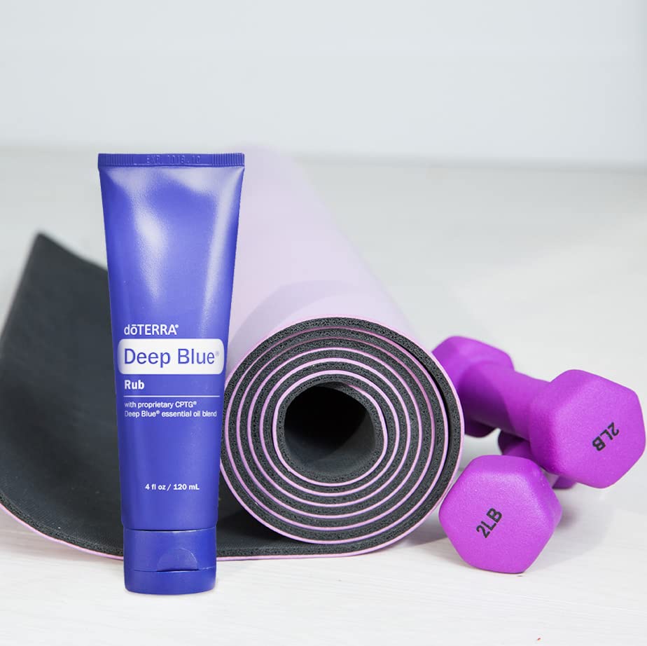 doTERRA Deep Blue Rub beside gym shoes after training for post-activity ease