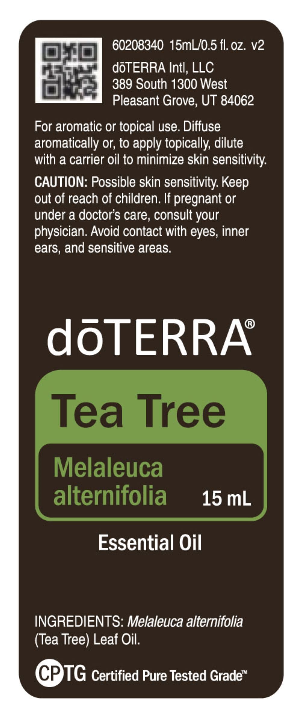 doTERRA Melaleuca bottle label close-up shows quality and purity guarantees.