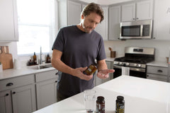 doTERRA MicroPlex VMz capsules in hand for convenient daily mineral intake