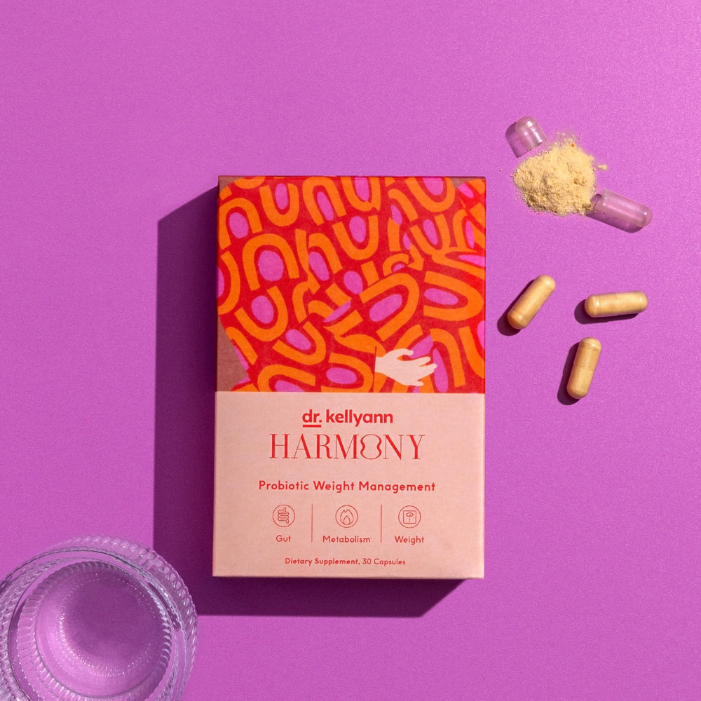 Dr. Kellyann Harmony bottle with glass suggesting a simple daily routine.